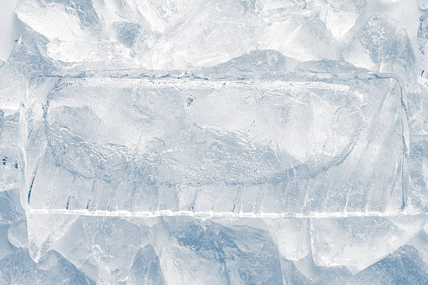 istock Natural textured ice block with frozen air bubbles structure and internal cavity surrounded with crushed ice. 2211147290