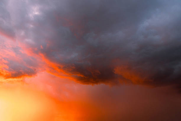 Dramatic, colorful, red-painted cloudy sky at sunset. Clouds' texture, abstract nature, background.