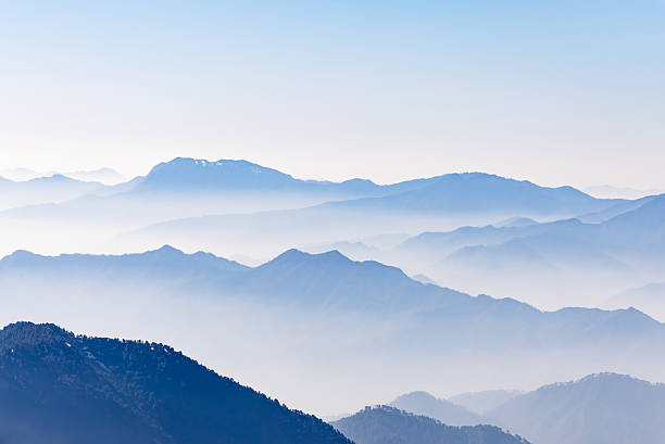 istock breathtaking mist covered mountain range at morning 2211150138
