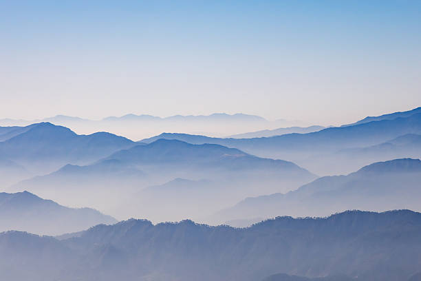 istock breathtaking mist covered mountain range at morning 2211150352