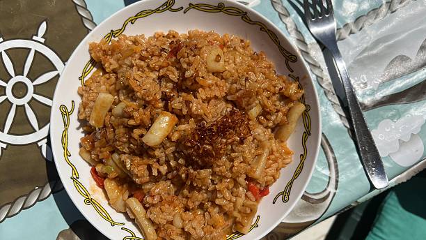 istock Typical Spanish paella consisting of rice, fish and seafood 2211150724