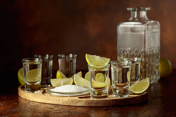 istock Gold tequila with salt and lime slices. 2211151243