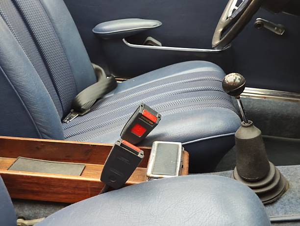 Fasten your seat belt please. Close-up of a seat belt in an airplane. No people.