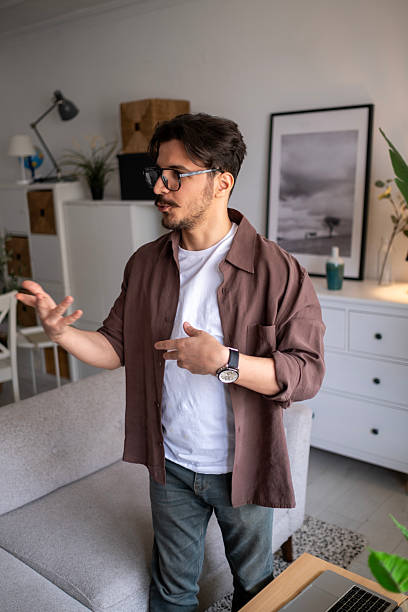 istock Disoriented bearded man moving with closed eyes, touching space with hands, confused with darkness, vision problems, eyesight disorder 2211157716