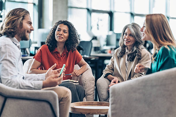istock Group of business colleagues talking 2211165864