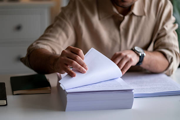 istock Businessman analysis meny financial documents, tax, accounting, statistics and analytic research concept 2211167636