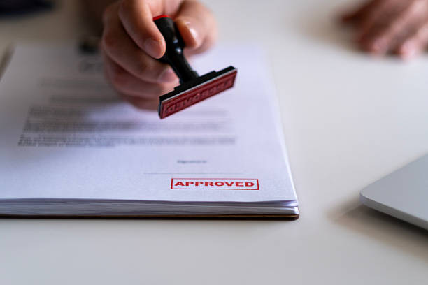 istock Business Man Stamping With Approved Stamp On Document. 2211168145