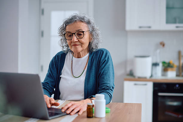 istock Senior woman surfing the net on a computer at home. 2211174535