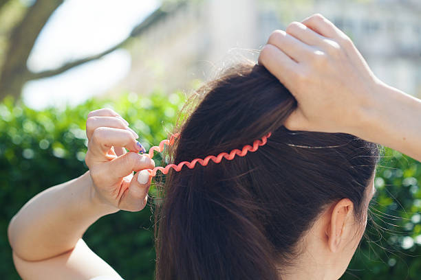 Woman tying up hair