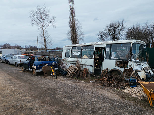 istock Rusty broken remnants of cars and buses at scrapyard 2211179238