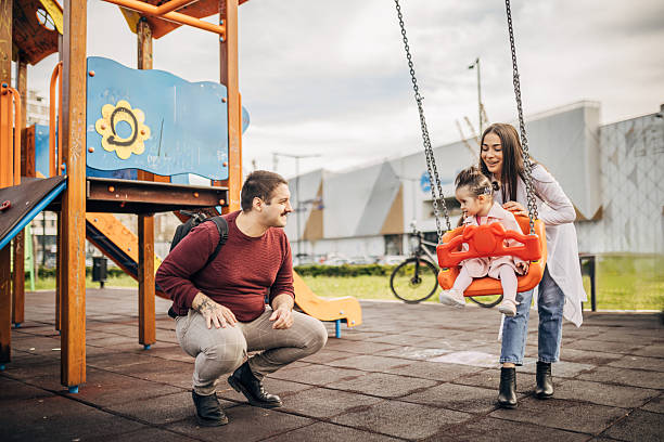 istock Beautiful family have fun at a park 2211180797