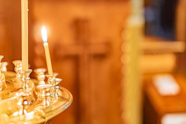 istock Close-up of a lit menorah with multiple arms in a warmly-lit interior setting 2211184608