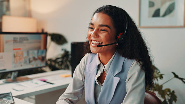 istock Customer support, happy and business woman on computer for virtual meeting, talking and interview. Media agency, publisher and person with headset for discussion for report, portfolio and webinar 2211193690