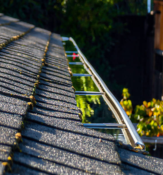 istock Clogged Roof Gutter Filled with Water after Rain 2211196182
