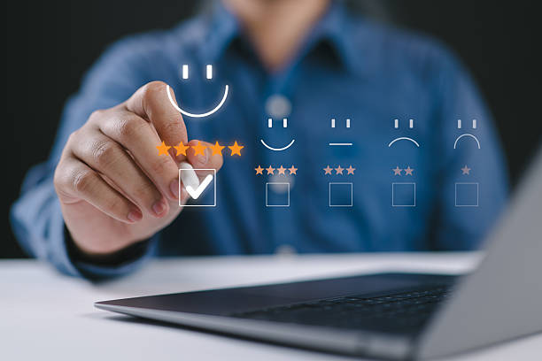 istock Customer service and Satisfaction concept, Business people are touching the virtual screen on the happy Smile face icon to give satisfaction in product and service. Rating very impressed. Good review 2211198004