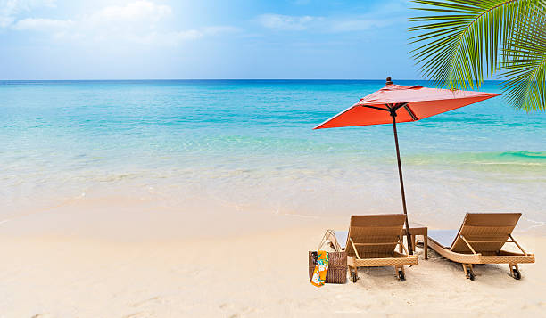 istock Tropical summer beach background, relaxing by the sea 2211199569