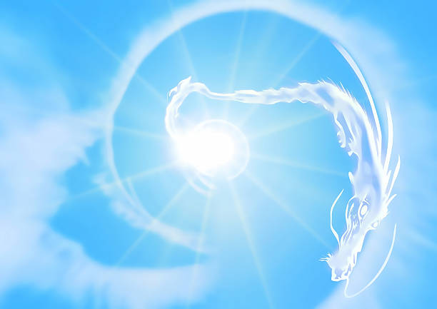 Ancient statueof angel in rays of light against sky with clouds