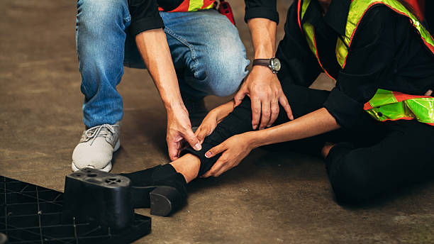 istock Warehouse worker has an accident from falling from a height while working in a factory. 2211207705