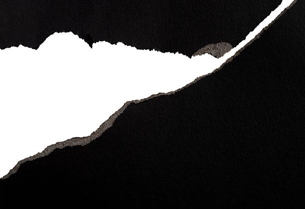 istock Background of torn black paper 2211210379