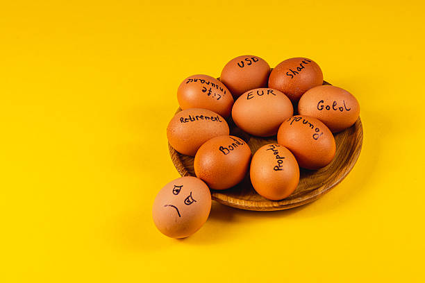 istock Choices illustrated with eggs on a yellow background 2211212404