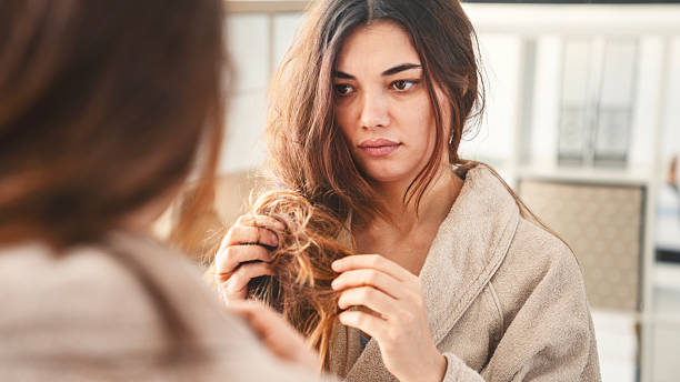 istock Young woman with hair problems 2211213884