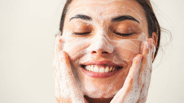 Beautiful woman washing her face