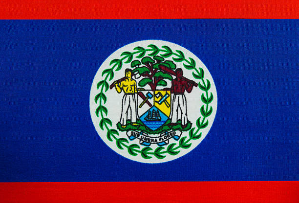 The Belize national flag features a blue background with red borders, showcasing the national emblem in the center. Colors symbolize the country's identity and culture.