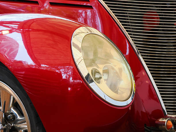 istock Close up of classic red vintage car headlight 2211217580