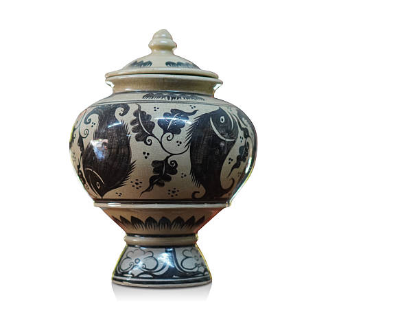 antique cream and black ceramic jar and ceramic lid on white background, object, copy space
