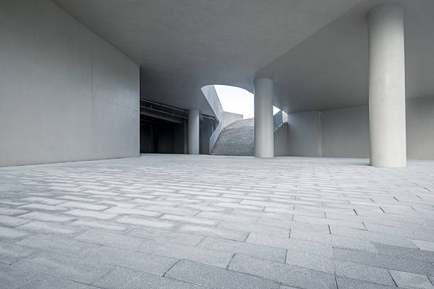istock Empty brick floor passage and buildings in modern city. 2211220512