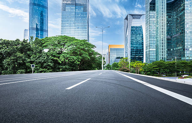 istock Empty asphalt road and cityscape with skyline in modern city. 2211220541