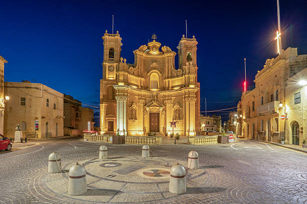 istock Gharb Parish Church and main square lit at night 2211223311