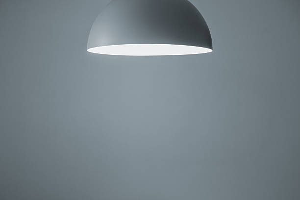 Bell shaped pendant light in living room, selective focus