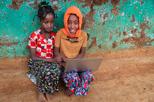 istock African children using a laptop, East Africa 2211223869