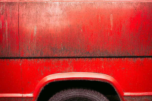istock Dry mud dirt stains on red metallic surface of a car 2211224469