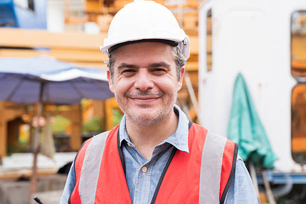istock Man, Engineer, Construction site. Portrait of engineer construction worker at work at construction site 2211225486