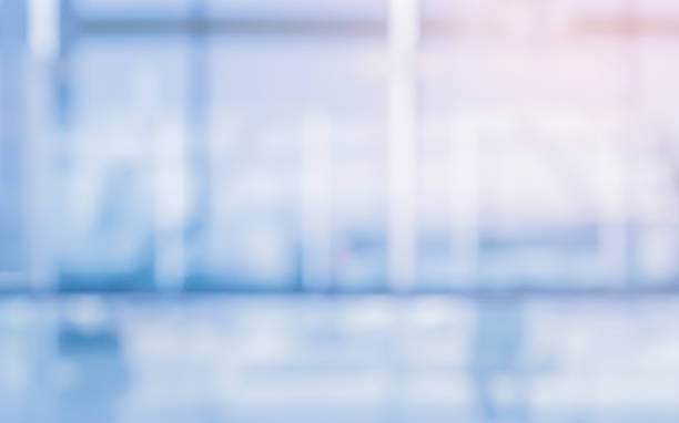 istock Abstract blurred inside interior of hospital building background with shine light for advertisement design and show content concept 2211227664