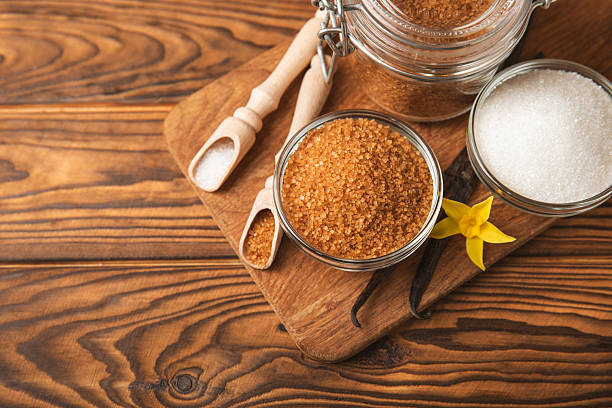 istock Aromatic vanilla sugar. Vanilla pods. Vanilla sticks, brown and white sugar in a bowl on a textured background. Vanilla flowers, spices and herbs for desserts and baking. Space for text. Copy space 2211229465