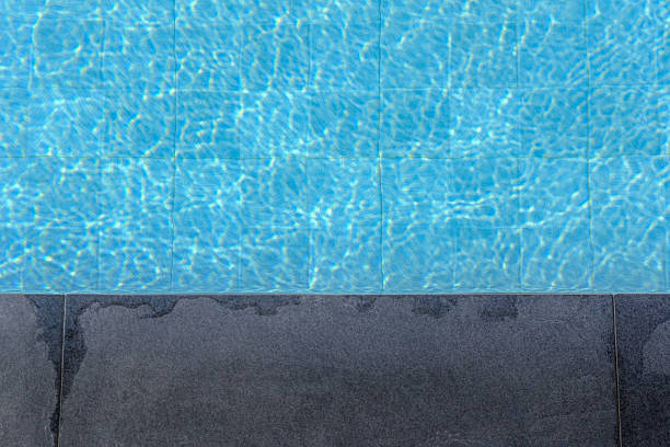 istock Swimming Pool Edge with Clear Blue Water 2211231904