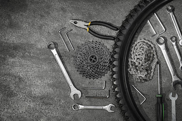 istock Parts of bicycle and tools on grey table, flat lay. Space for text 2211232073
