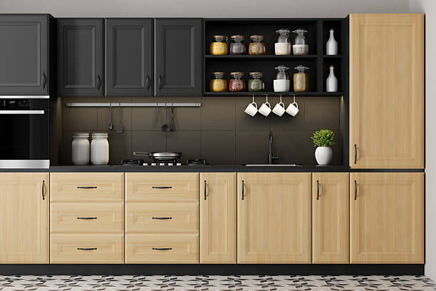 Warm and inviting Scandinavian kitchen featuring classic-style lower cabinets in natural pine wood and matte black upper cabinetry. The minimalist dining setup, retro-inspired floor tiles, and expansive floor-to-ceiling window create a harmonious blend of tradition and modernity. Outside, a serene autumn landscape dusted with early snow adds seasonal charm. Ideal for promoting timeless kitchen design, Scandinavian interiors, cozy open spaces, and nature-integrated architecture.