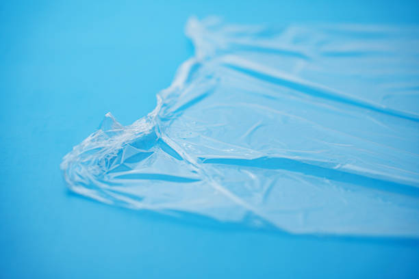 istock Transparent stretch film for packaging on a blue background. 2211235593