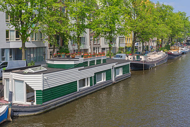 Large Houseboat With Rooftop Terrace at Canal in Amsterdam Netherlands