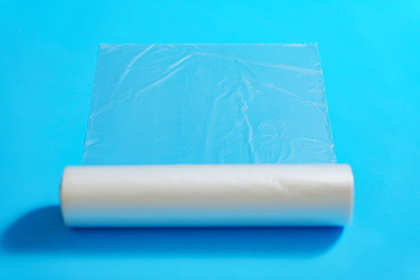 istock Roll of transparent packaging bags on a blue background. 2211238364