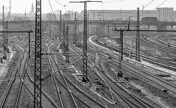 Germany, Berlin, Prenzlauer Berg, March 28, 2025 -Railroad tracks and bridge against clear sky