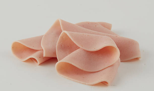 istock Fresh Bologna Slices isolated nature background with clipping path 2211242548