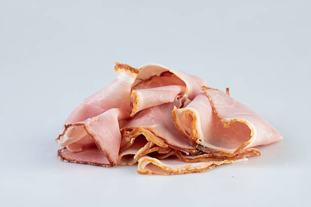 istock fresh ham slices isolated nature background with clipping path 2211242593