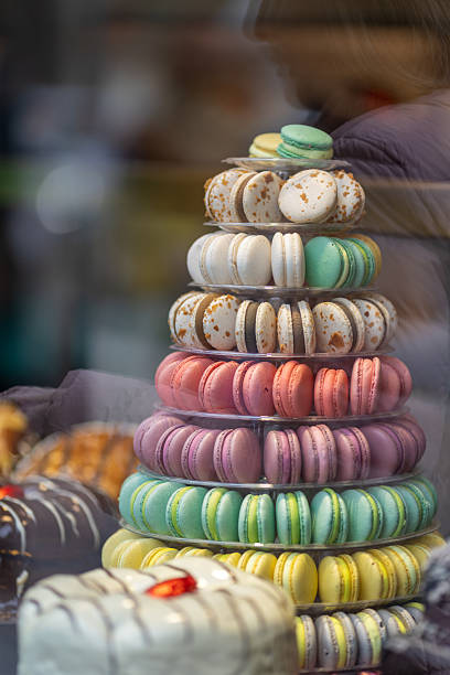 istock Colorful biscuits macaroons inside a display case in a pastry shop 2211243135