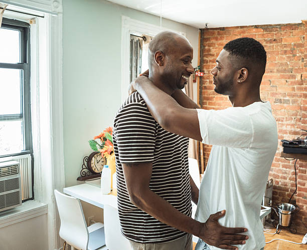istock homosexual couple dancing at home 2211244256