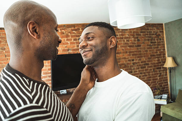 istock homosexual couple dancing at home 2211245437
